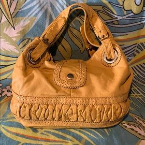 Mustard colored shoulder bag.